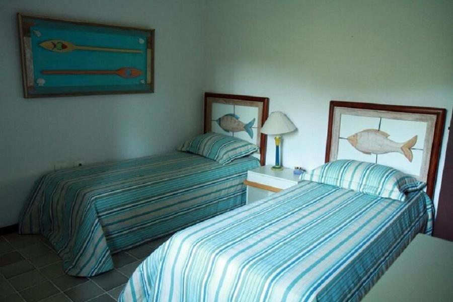 SMI012 Casa charmosa em condomínio à beira mar