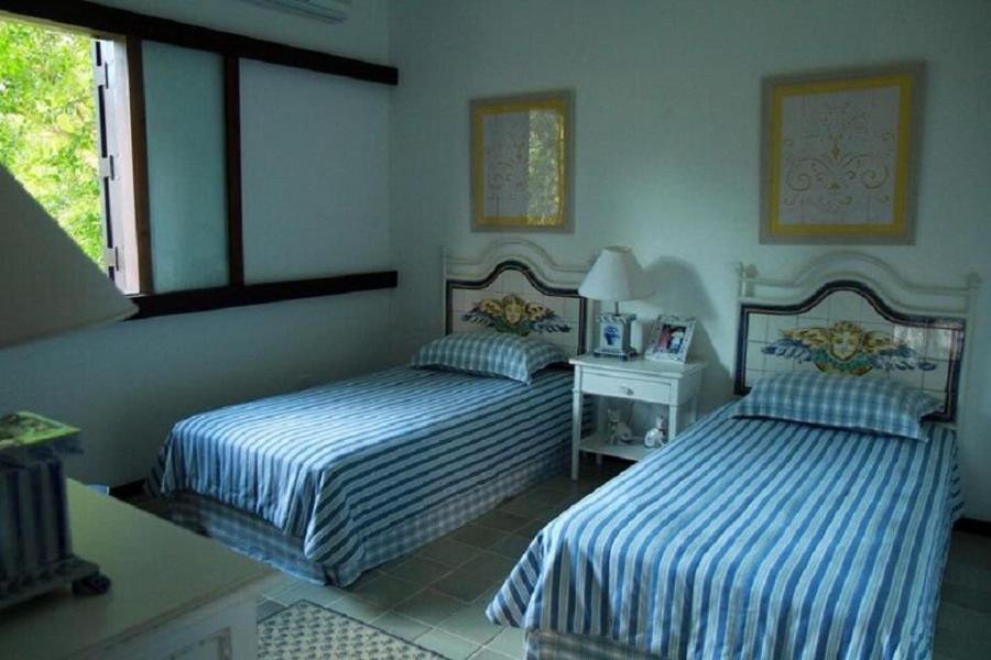 SMI012 Casa charmosa em condomínio à beira mar