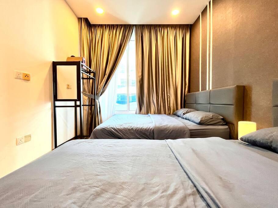 Grand Suite @ The Wave Residence-Cozy 2-BR Retreat: AC, Street Views & Games photo 6