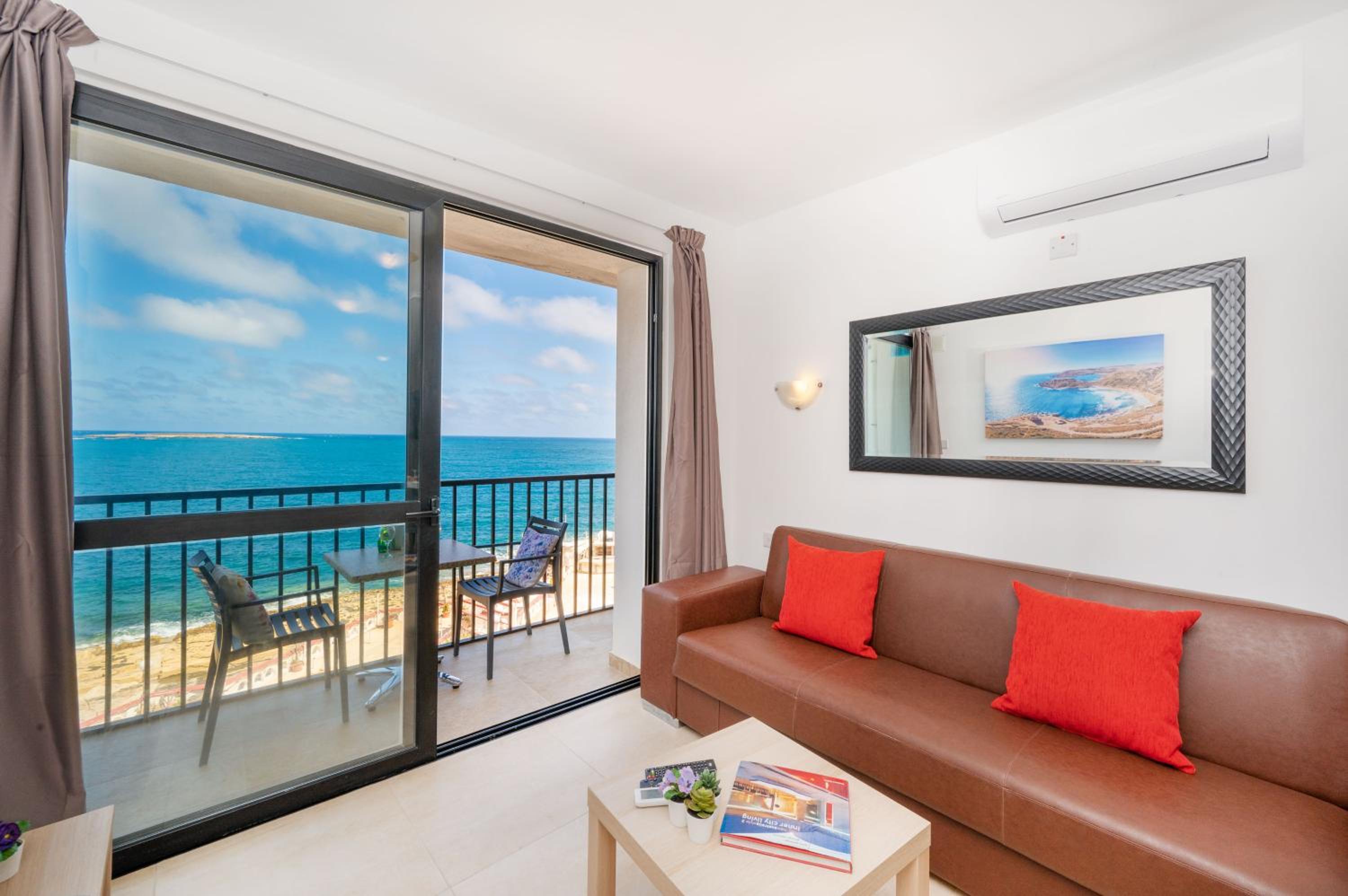 Islet Promenade Seafront 1 Bedroom Apartment with sea view balcony by Getawaysmalta photo 2