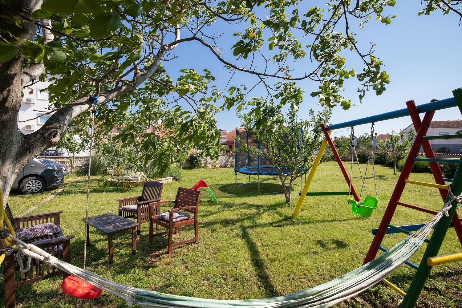 Apartments Dadic with parking & playground view 5