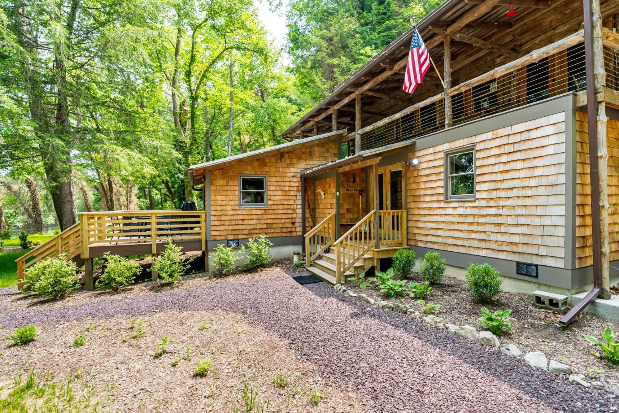 Log cabin w riverfront & hot tub - main view