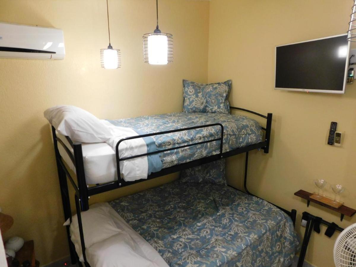 Centrally located in Jaco, walk to beach, beautiful pool! Each Villa Paradise is 1bd 1bath Condo Units sleep 5 or book both units and open connecting door 
