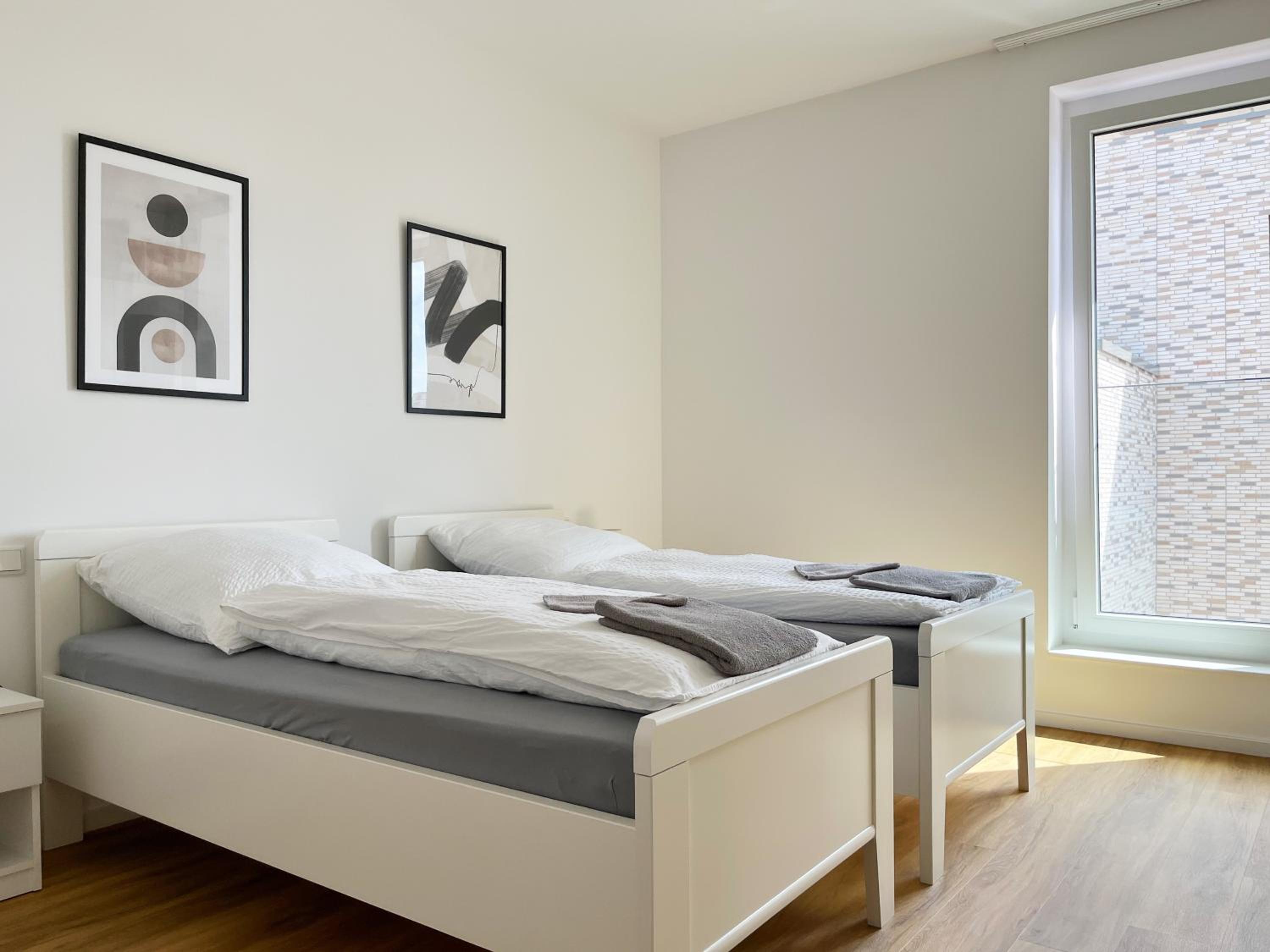 Moderne Apartments im Herzen der Stadt I private Tiefgarage mit Ladesäulen I home2share