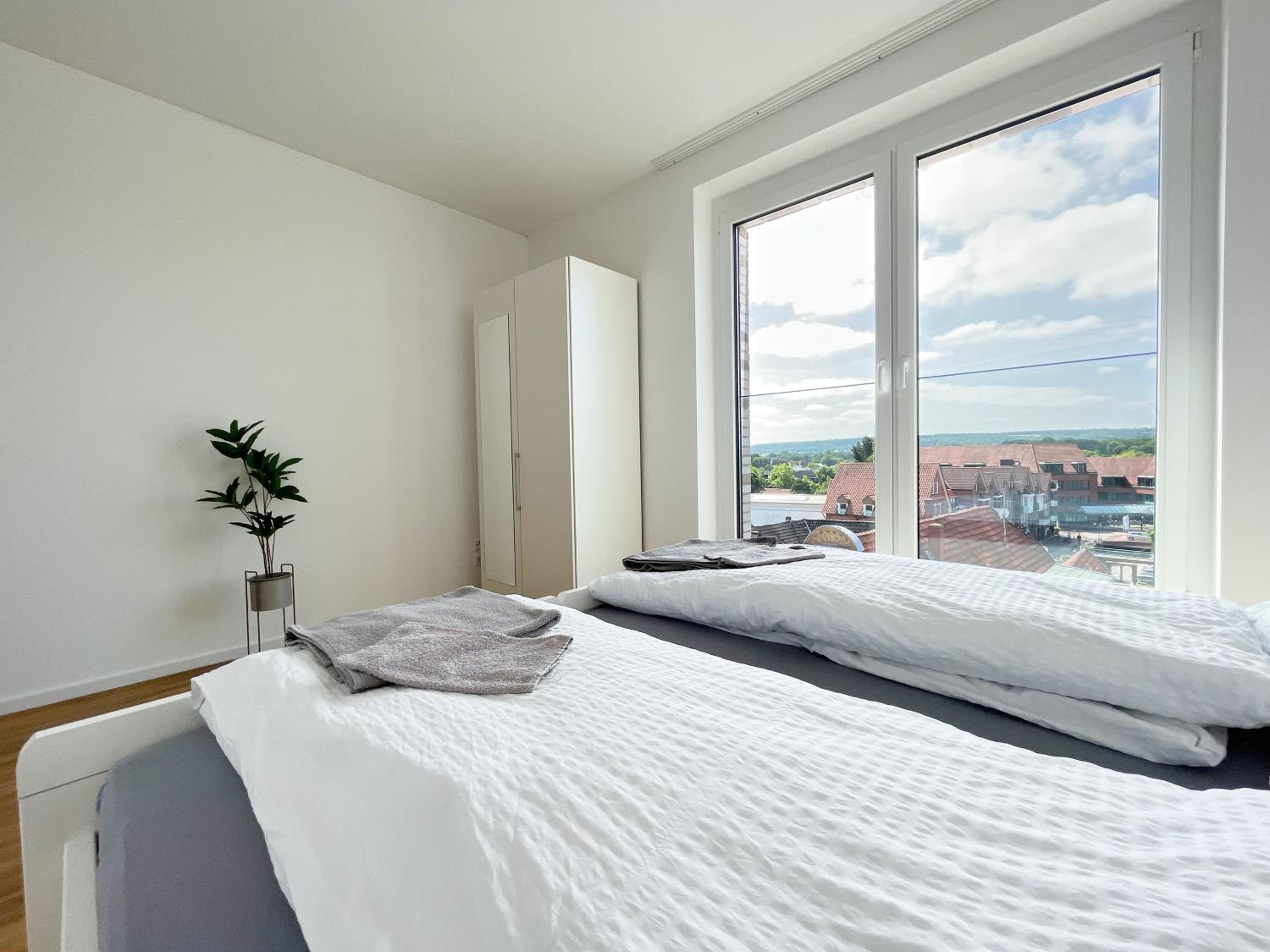 Moderne Apartments im Herzen der Stadt I private Tiefgarage mit Ladesäulen I home2share