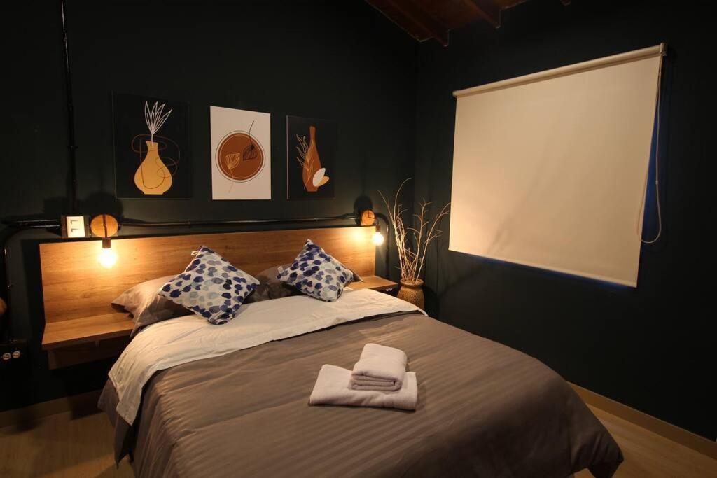 Apartamento cerca Unidad Deportiva Belén - ONE202 By Roots Rentals