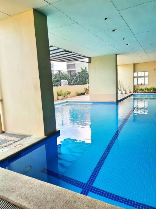 Modern Spacious 2BR Condo with Wifi at Aurora Gardens San Juan City near Rob Magnolia view 4