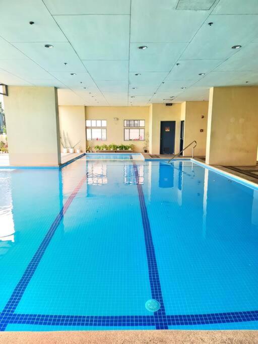 Modern Spacious 2BR Condo with Wifi at Aurora Gardens San Juan City near Rob Magnolia view 5