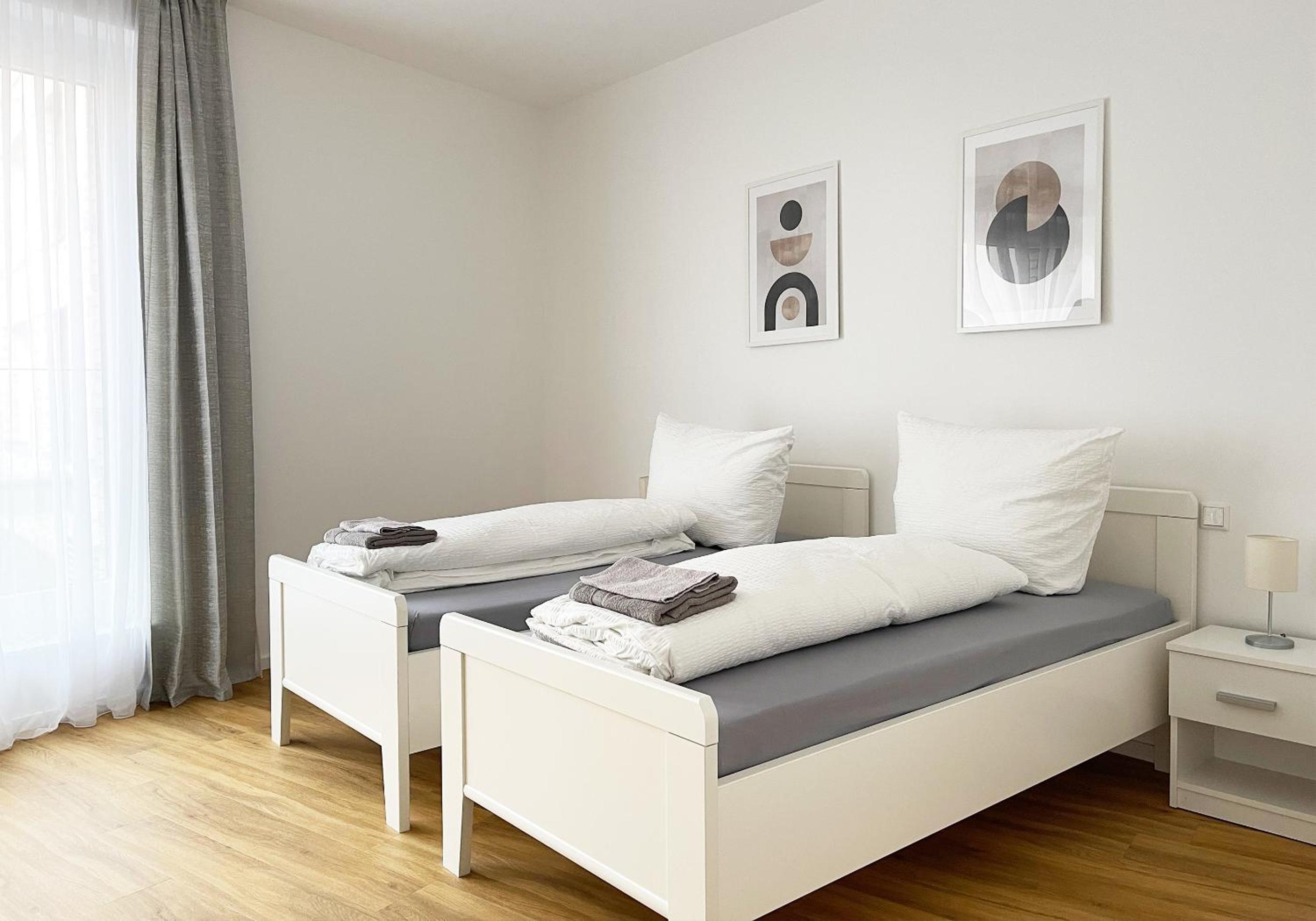 Moderne Apartments im Herzen der Stadt I private Tiefgarage mit Ladesäulen I home2share