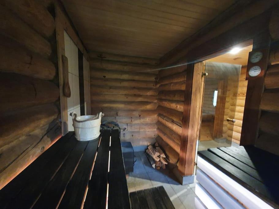 Part of house, sauna and terrace view 4