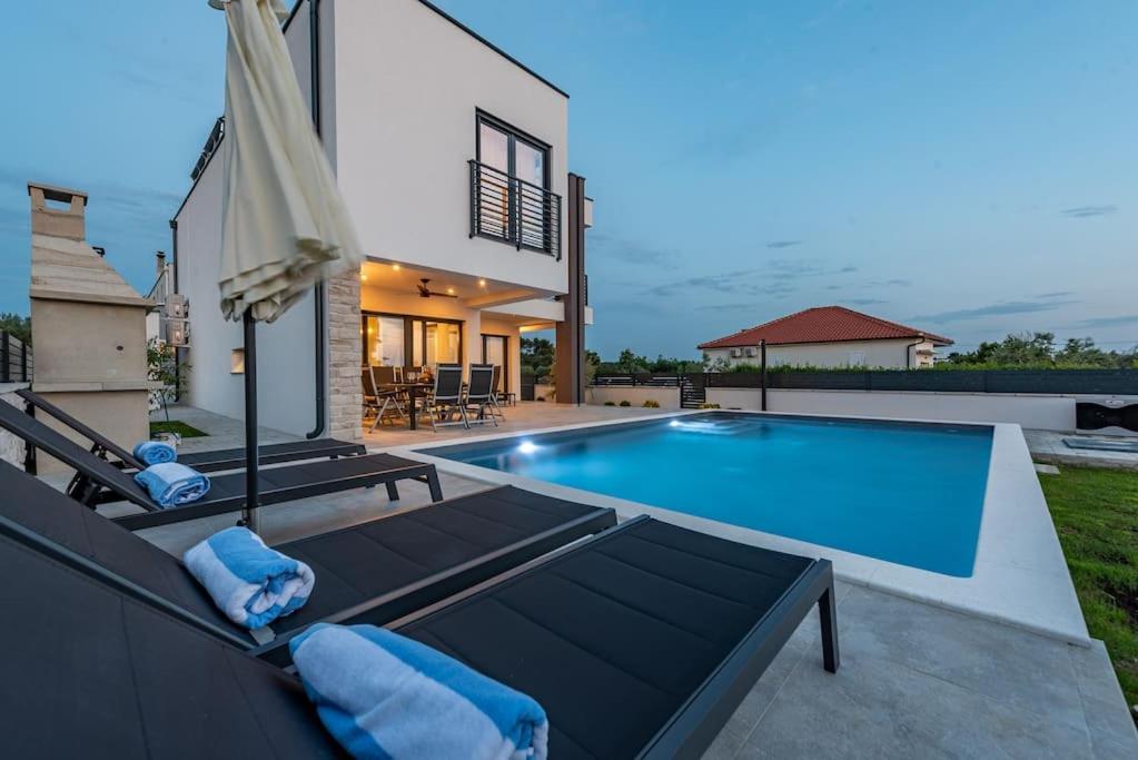 Brand new Villa Olivia 30m from the sea with heated pool and jacuzzi view 5