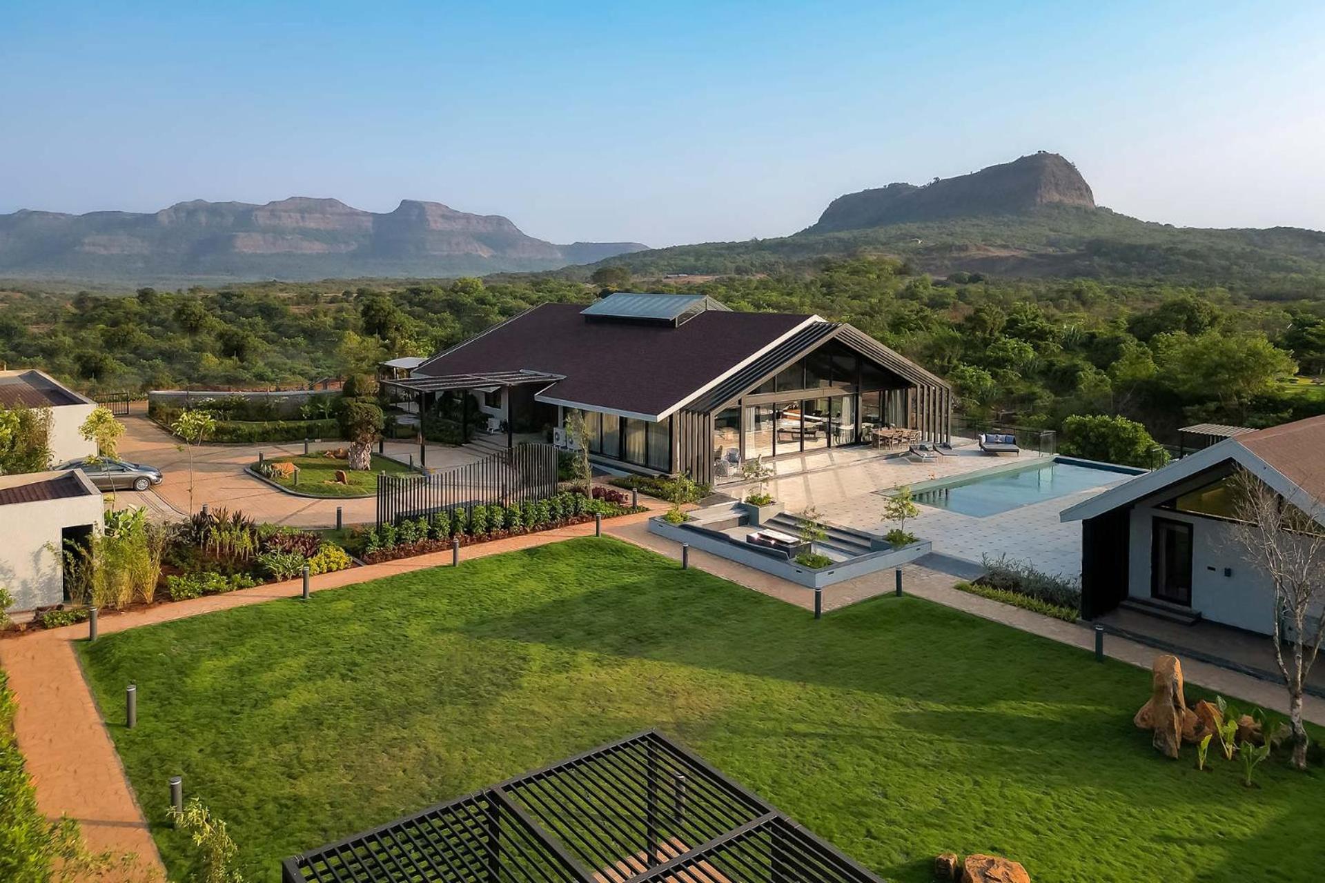 StayVista's The Barn - Mountain-View Luxury Mansion with Heated Infinity Pool, Deck, Jacuzzi, Lawn featuring a Gazebo and Firepit
