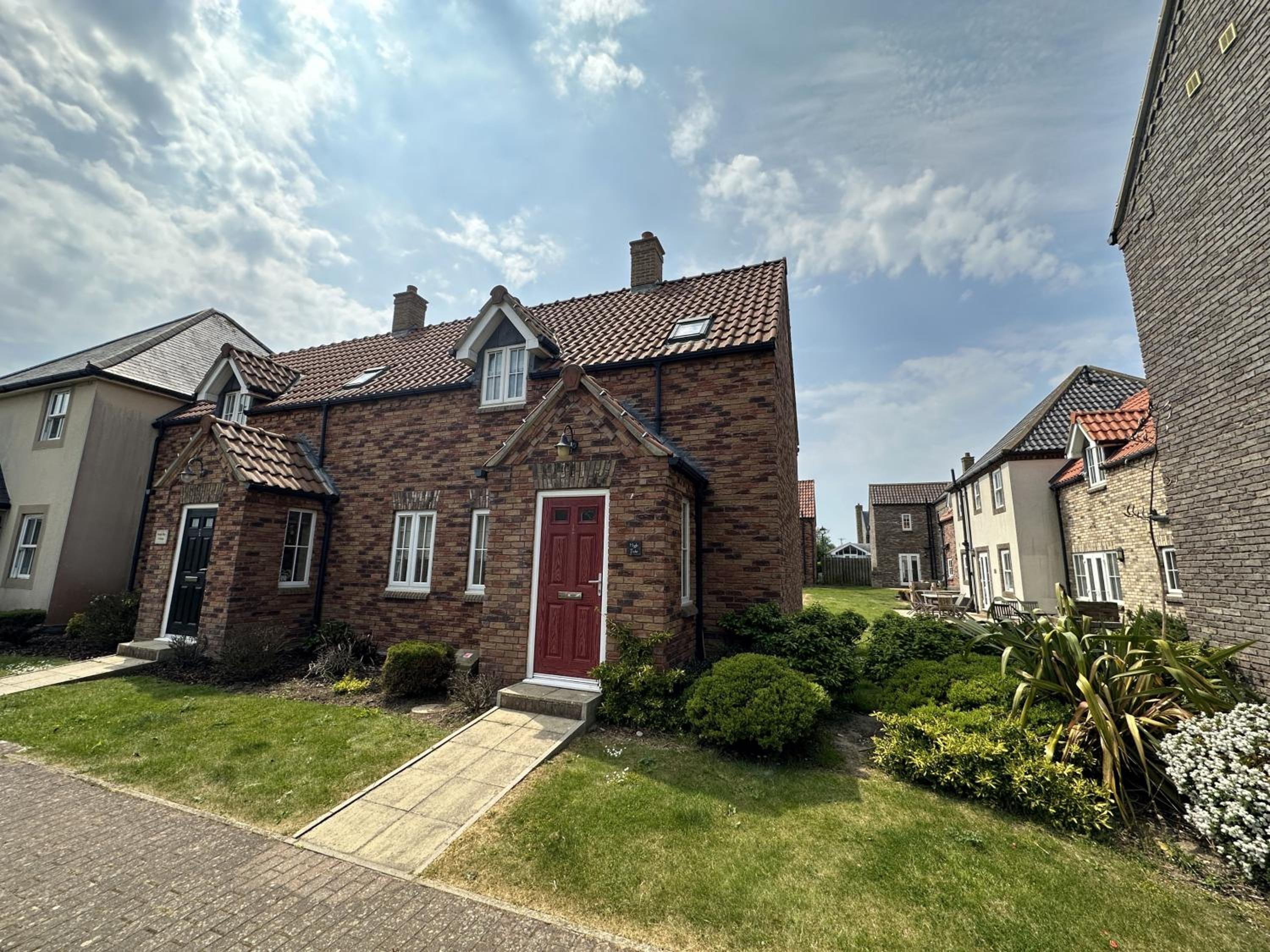 High Tide Cottage - Part of the The Bay Filey Holiday Village with pool, gym and direct beach access, pub, restaurant, tennis and meadows walks