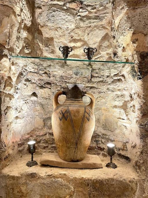LIVING IN A CAVE UNDER ACROPOLIS