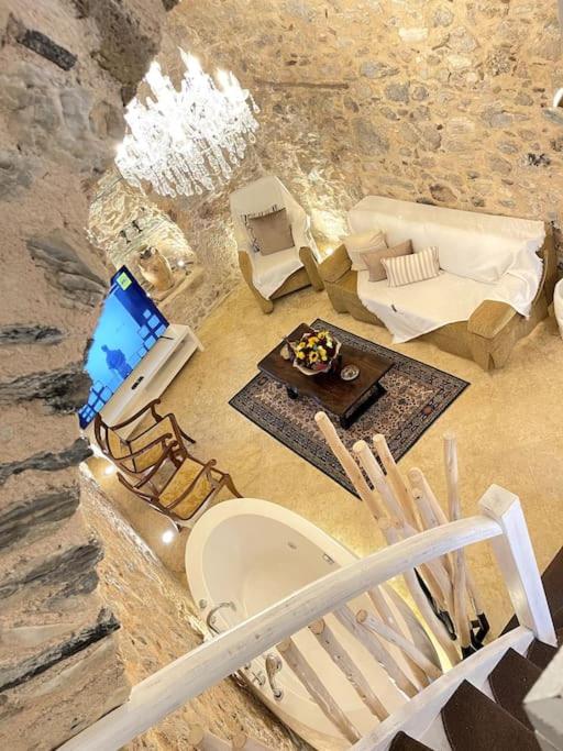 LIVING IN A CAVE UNDER ACROPOLIS