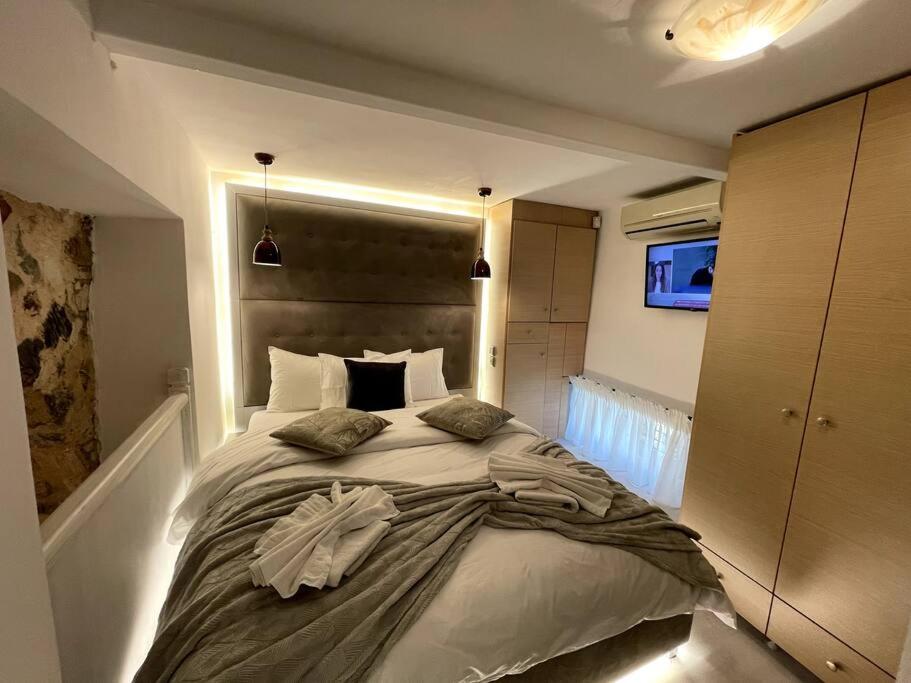 LIVING IN A CAVE UNDER ACROPOLIS