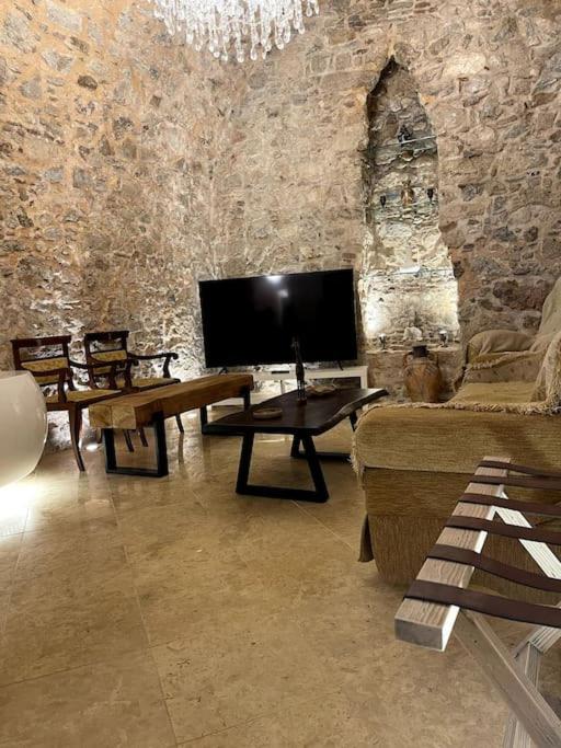 LIVING IN A CAVE UNDER ACROPOLIS