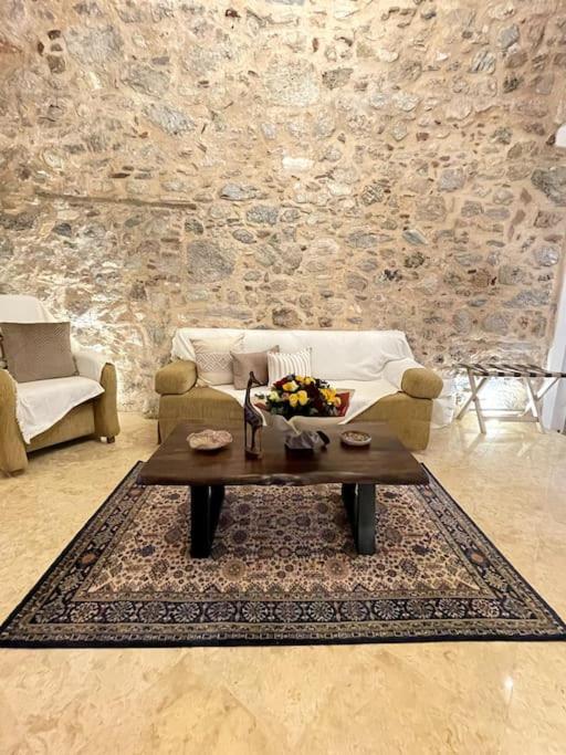 LIVING IN A CAVE UNDER ACROPOLIS