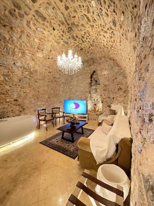 LIVING IN A CAVE UNDER ACROPOLIS