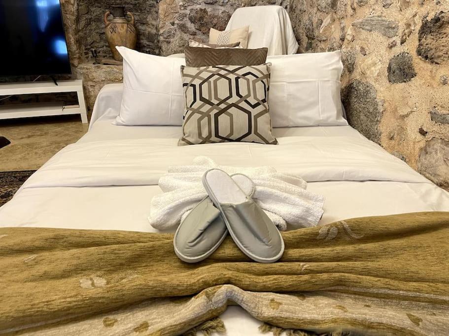 LIVING IN A CAVE UNDER ACROPOLIS