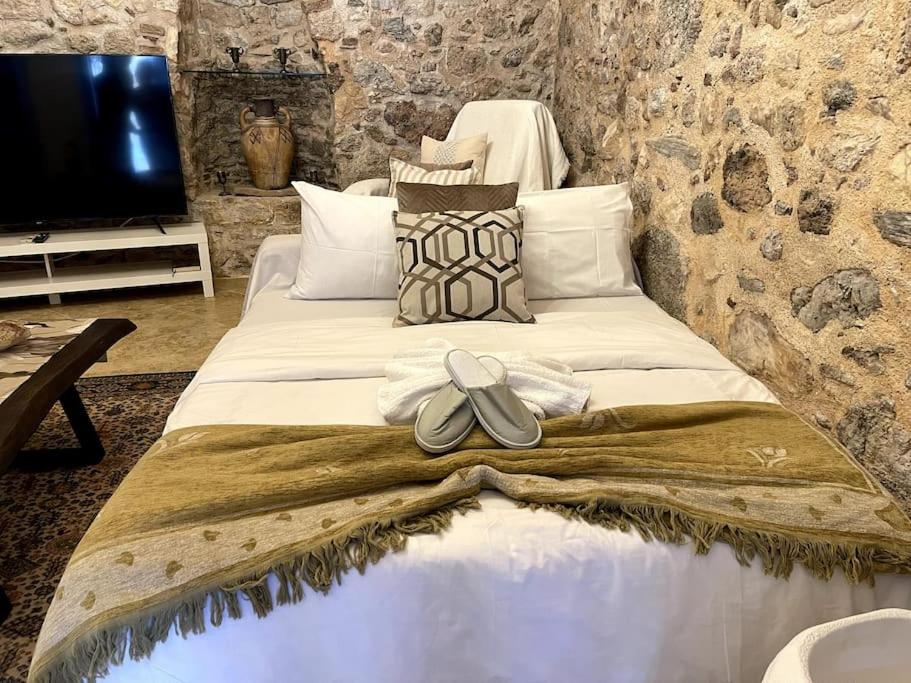 LIVING IN A CAVE UNDER ACROPOLIS