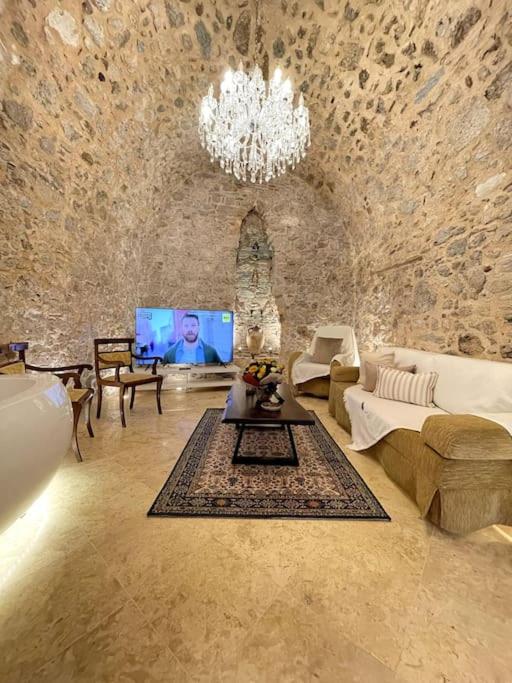 LIVING IN A CAVE UNDER ACROPOLIS