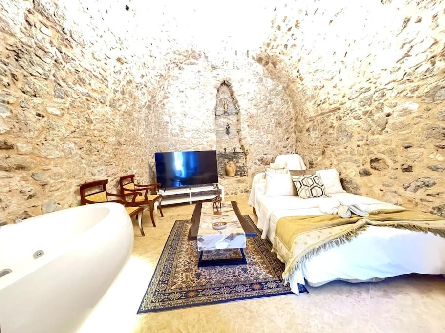 LIVING IN A CAVE UNDER ACROPOLIS