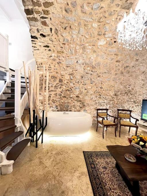 LIVING IN A CAVE UNDER ACROPOLIS
