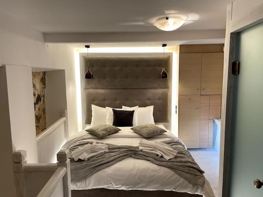 LIVING IN A CAVE UNDER ACROPOLIS