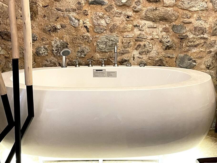 LIVING IN A CAVE UNDER ACROPOLIS
