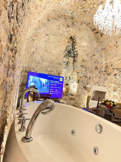 LIVING IN A CAVE UNDER ACROPOLIS
