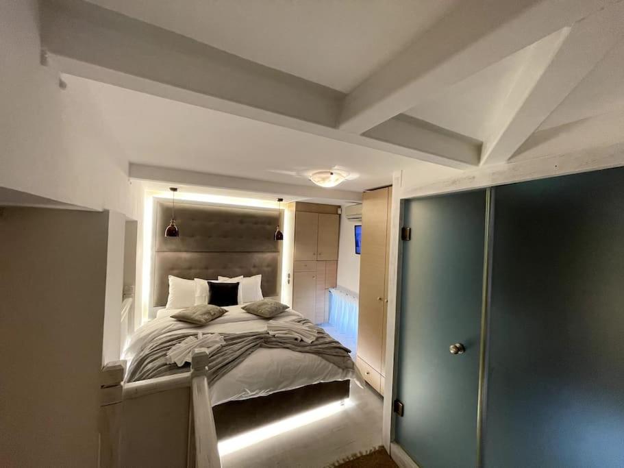 LIVING IN A CAVE UNDER ACROPOLIS