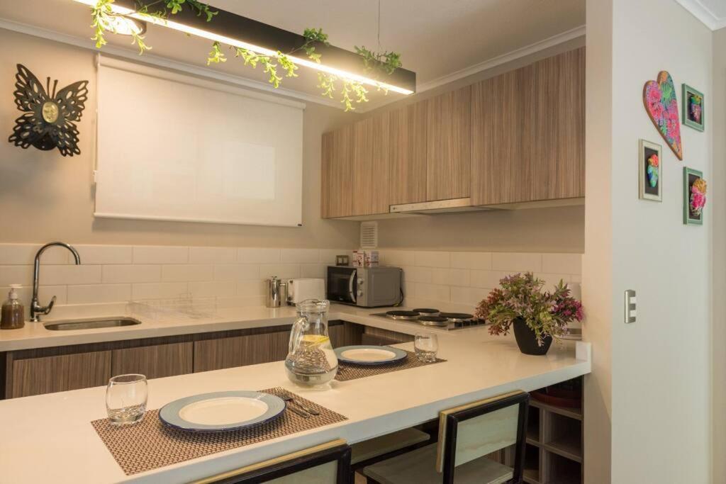 PUCON depto NUEVO! DOS DORMITORIOS DOS BAÑOS, en condominio con estacionamiento,balcon, super equipado, WIFI Y CABLE, PISCINA CON JARDINES, ZONA TRANQUILA 