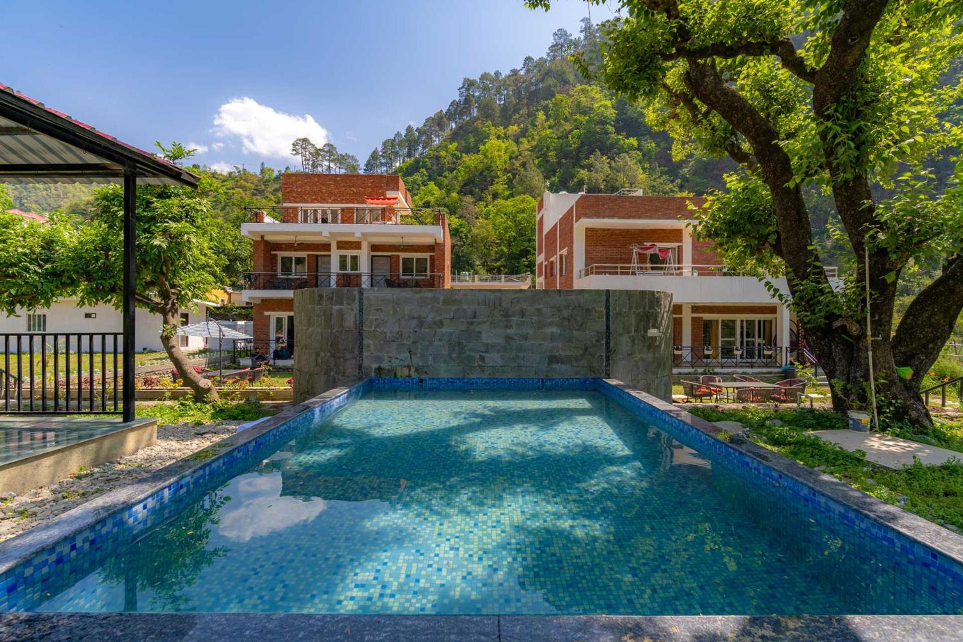 Prakriti with River View- Pet Friendly Retreat with Plunge Pool by StayVista