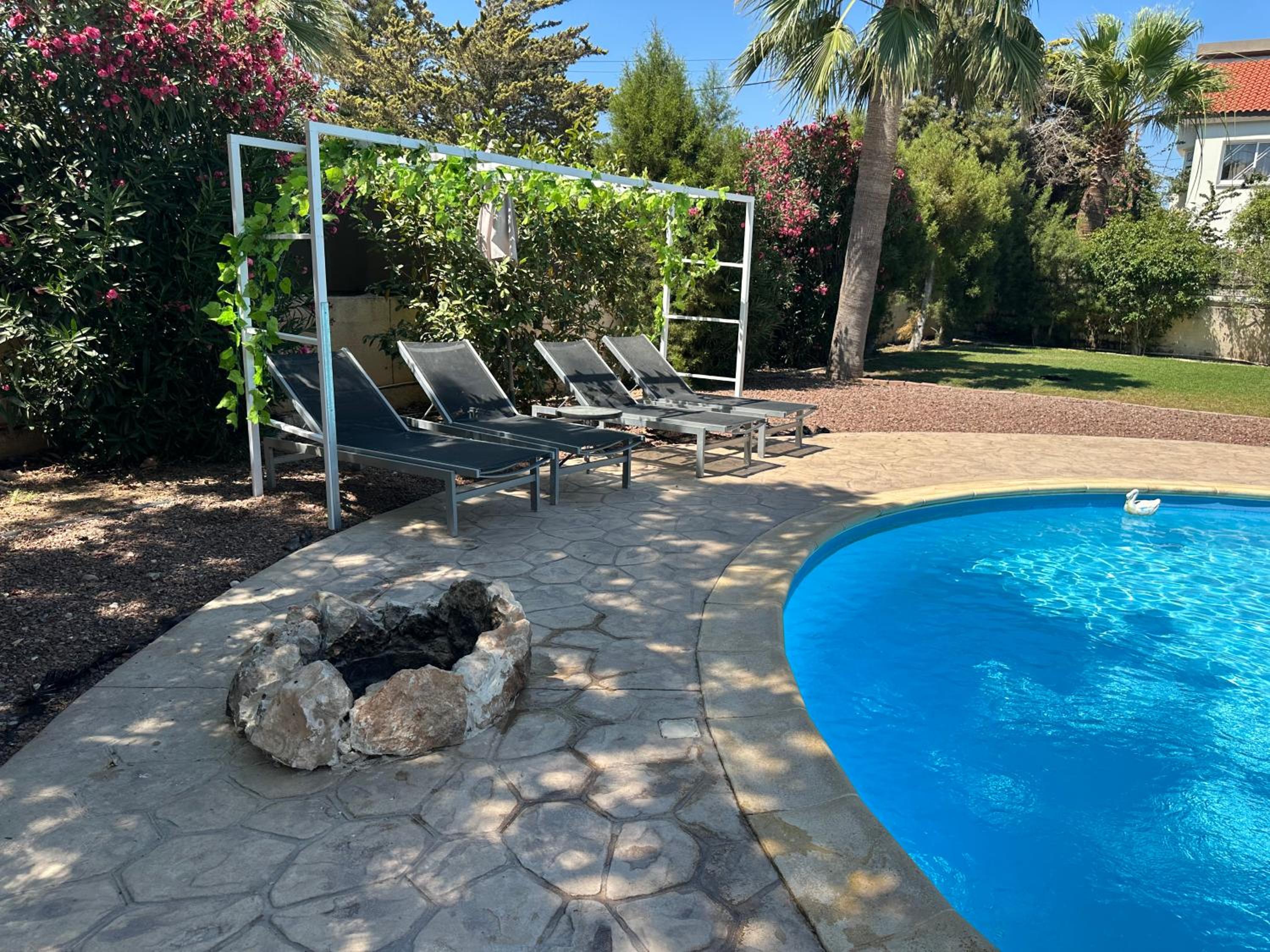 Mediterranean poolside garden cottage