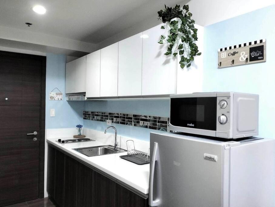 New Makati 1BR Resort View above AIR Mall 50-inch SMART TV view 2