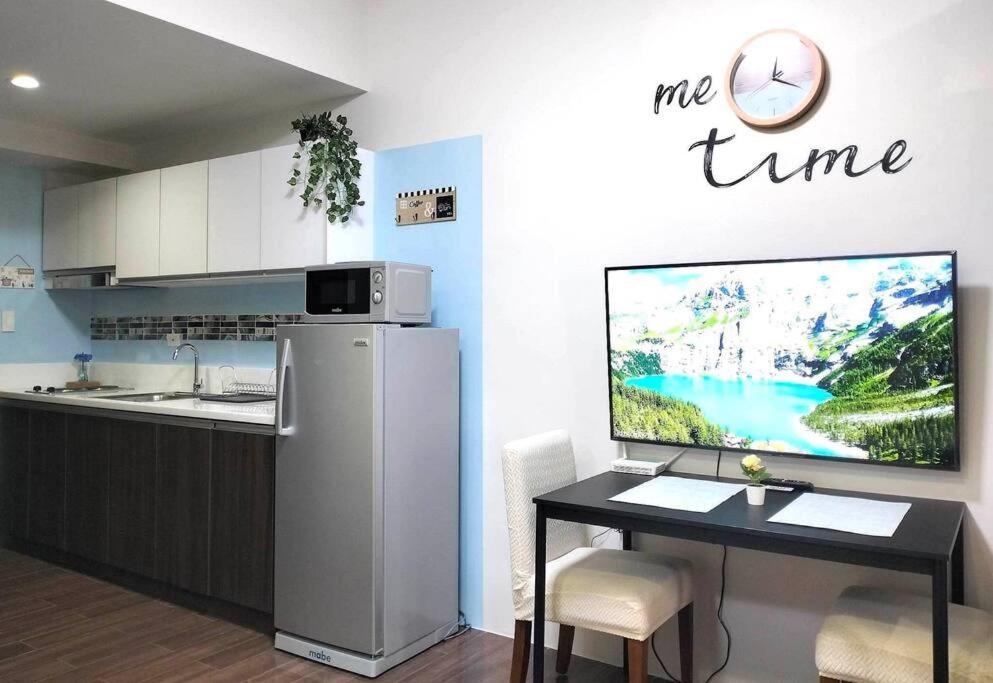 New Makati 1BR Resort View above AIR Mall 50-inch SMART TV view 5