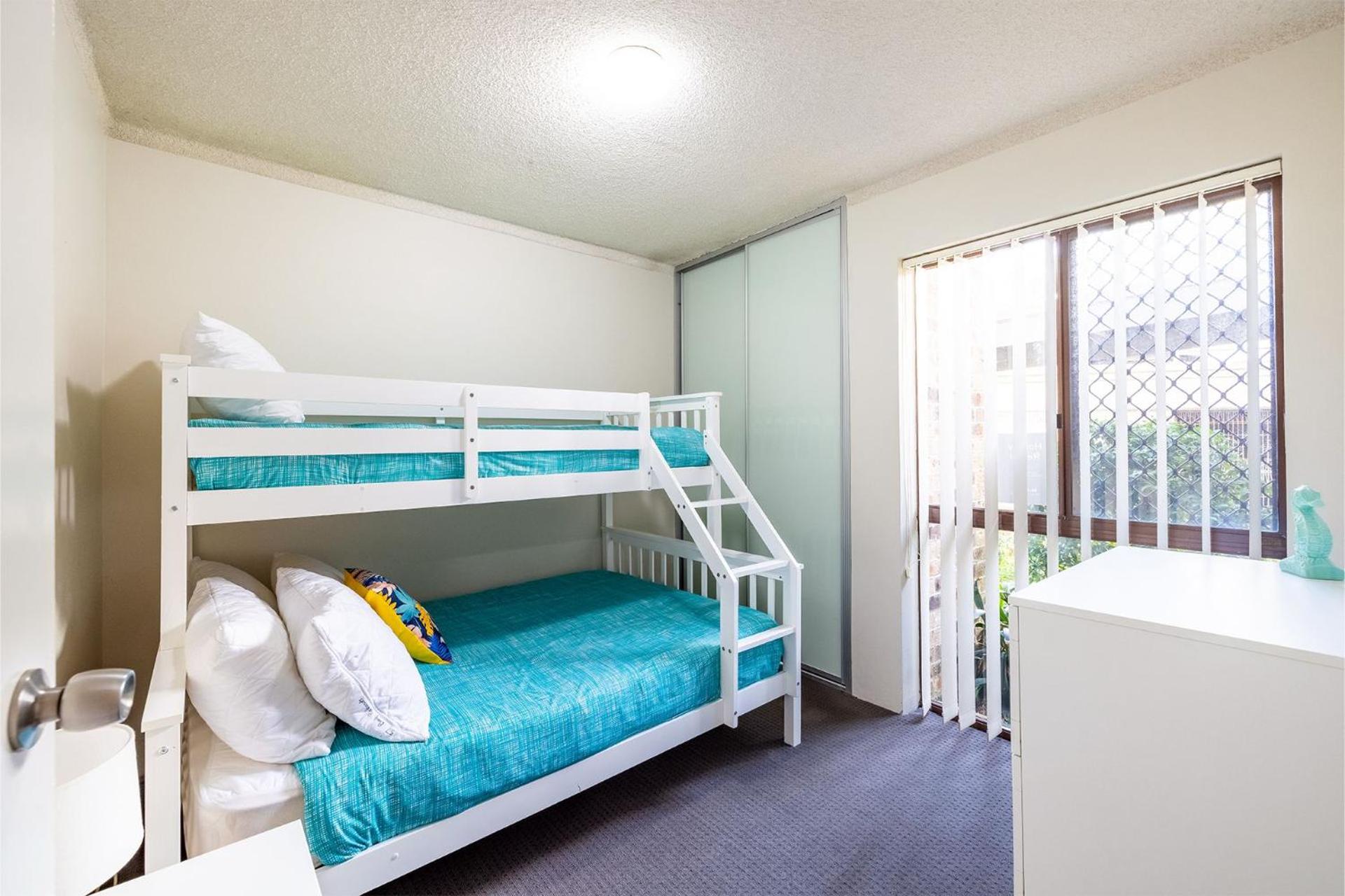 Bay Parklands 57 ground floor unit with pool tennis court and aircon