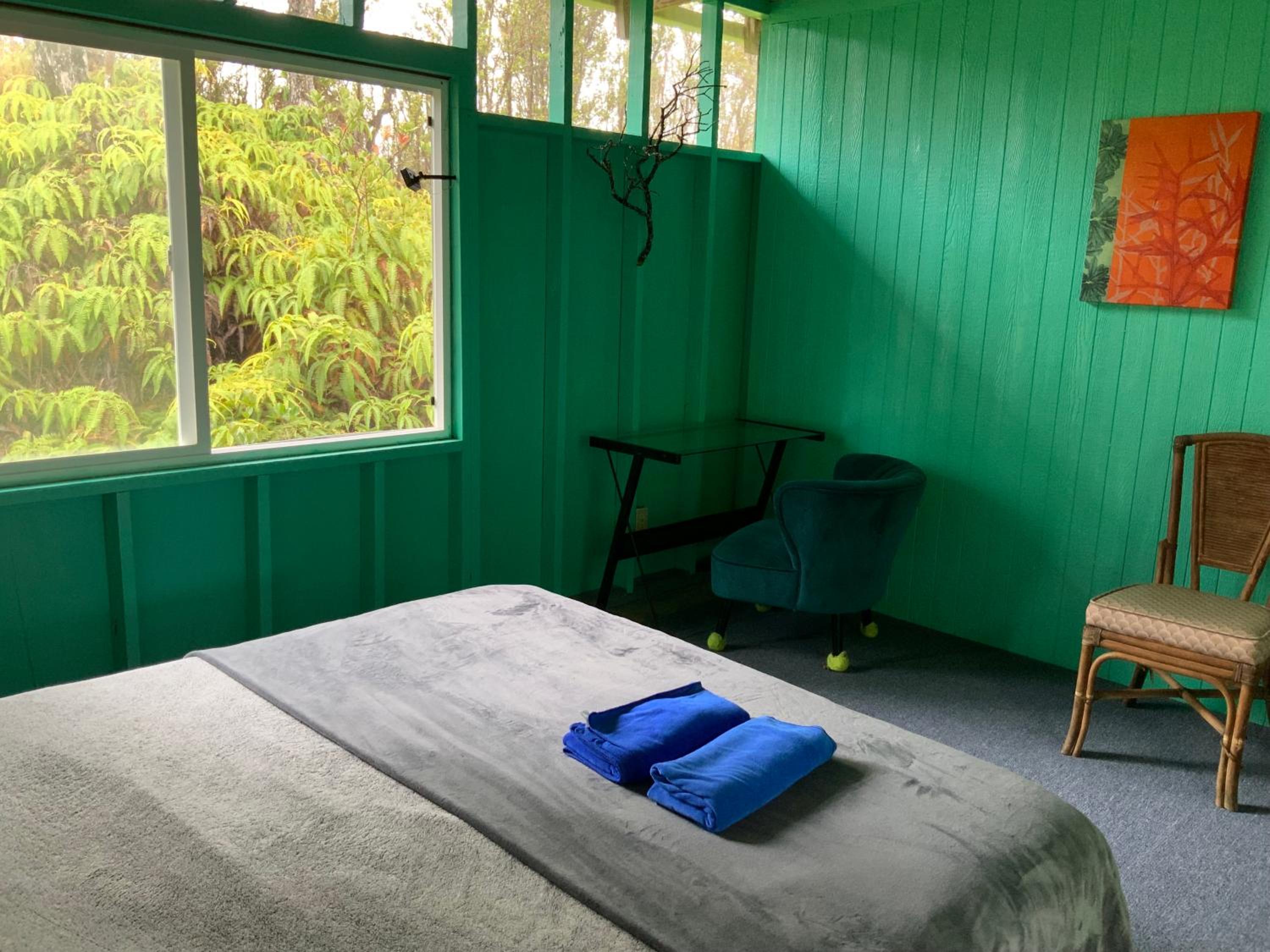Simple Rustic studio deluxe bed in tropical fruits garden view 2