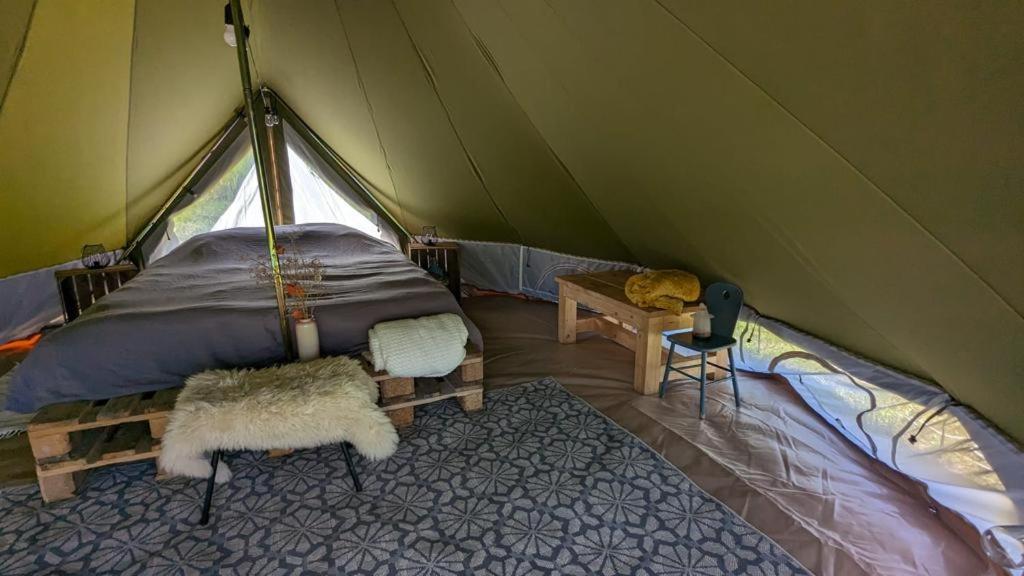 Campingspots to put on your own tent with or without electricity, with no bed for 12 euro or 25 euro and 2 furnished glampingtents for minimum 75 euro in a