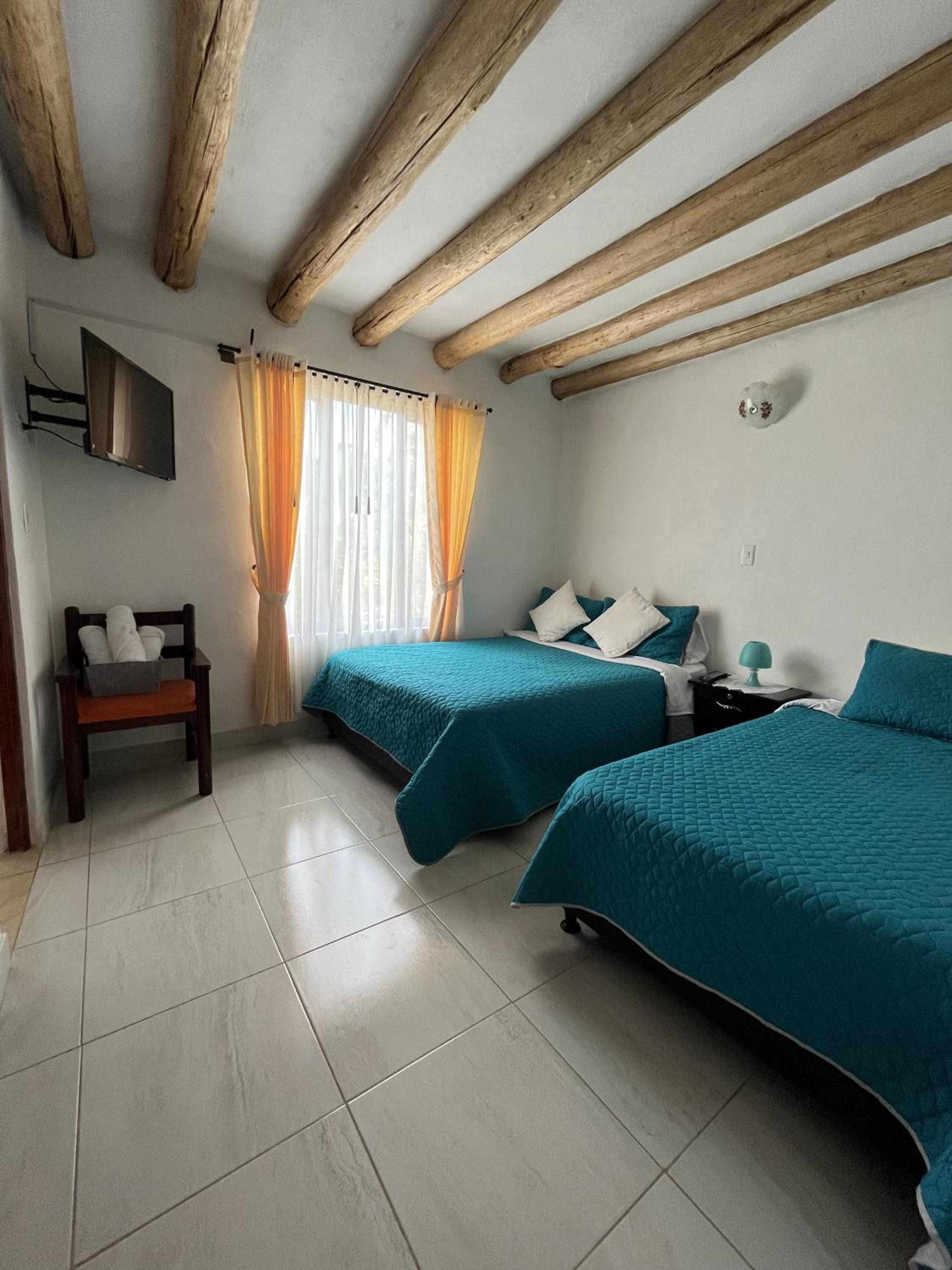 Cuatro habitaciones en la cabaña Quinta Buenos Aires