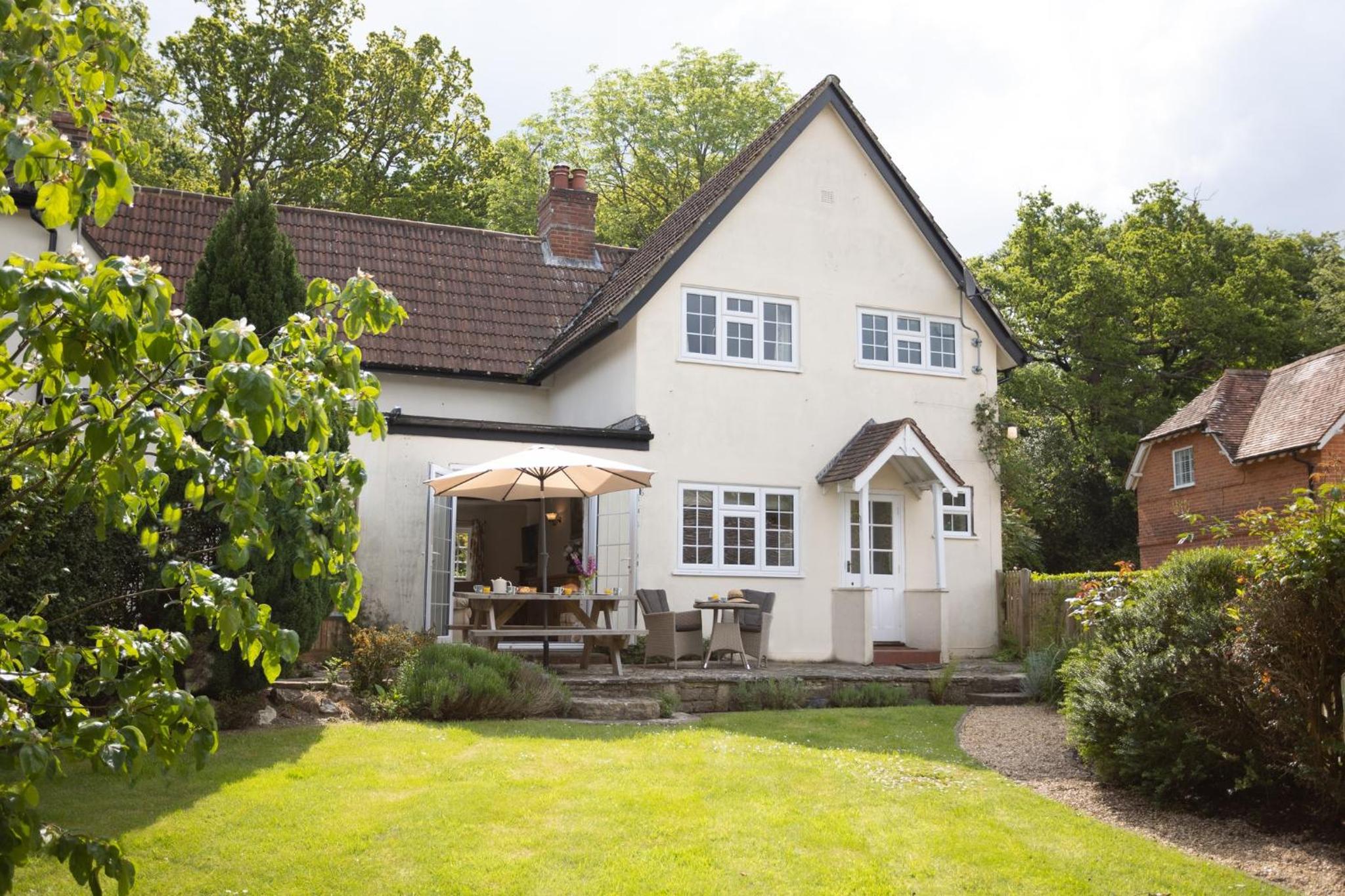 Spacious family cottage with private garden and forest walks