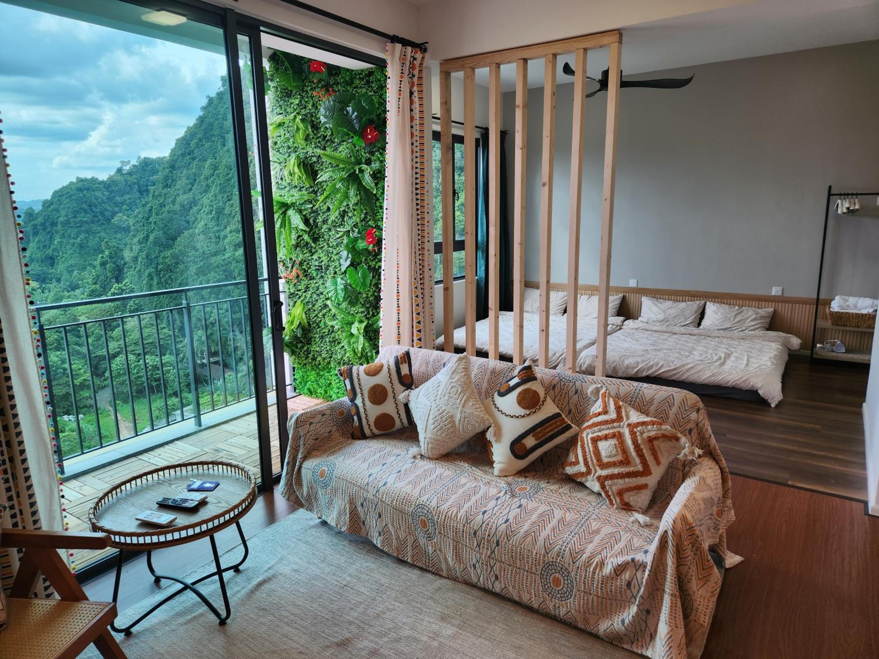 Unique Boho Style Condo with NETFLIX for up to 5PAX - Enjoy Mountain View while swimming at the Infinity Pool & Natural Hotspring Pool, 2mins walk to the L photo 1