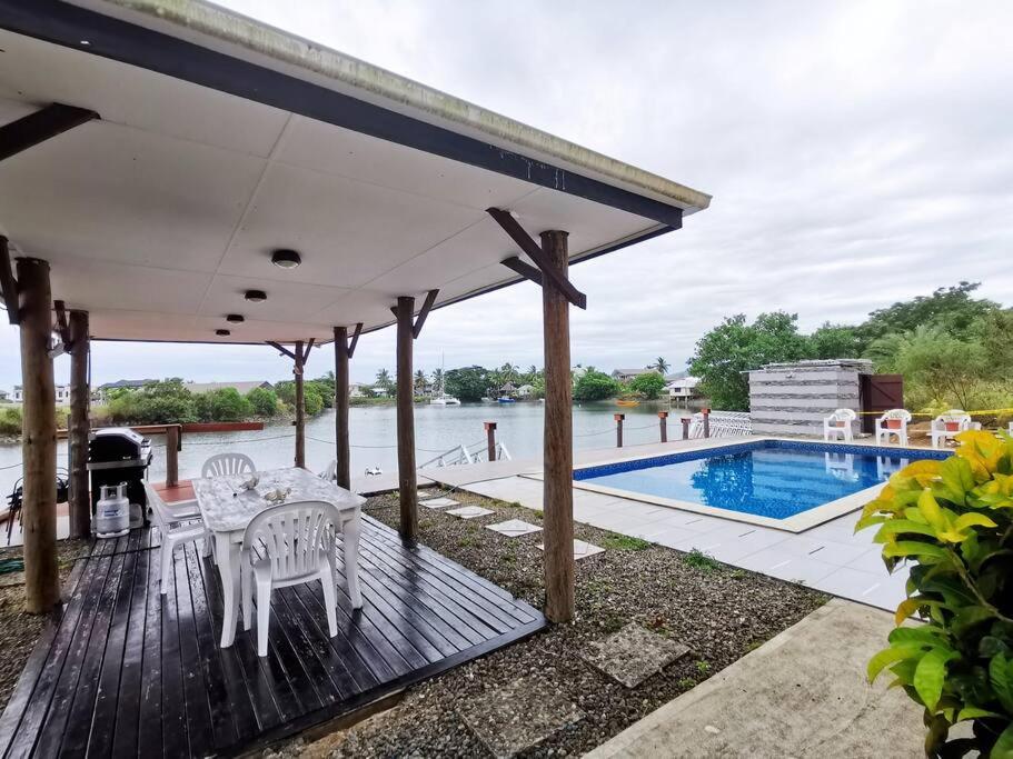Master Bedroom in Shared Cozy River View Pool Apartment