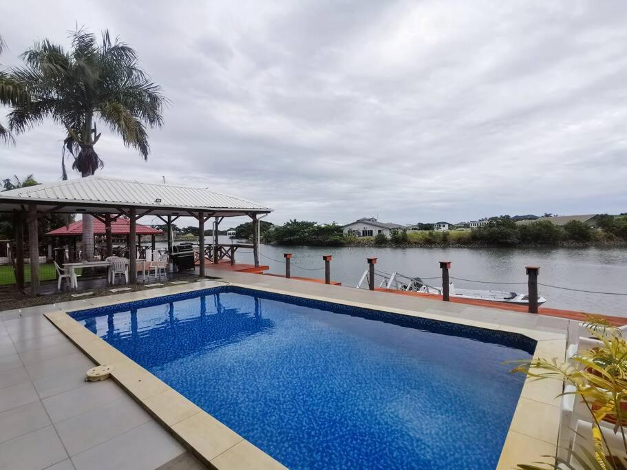 Master Bedroom in Shared Cozy River View Pool Apartment