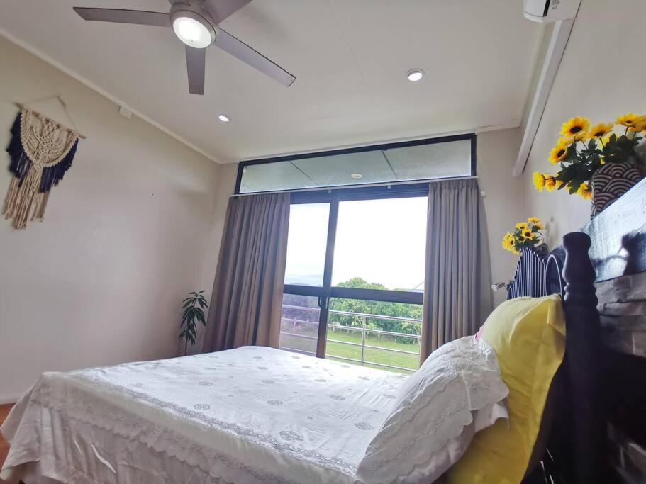 Master Bedroom in Shared Cozy River View Pool Apartment