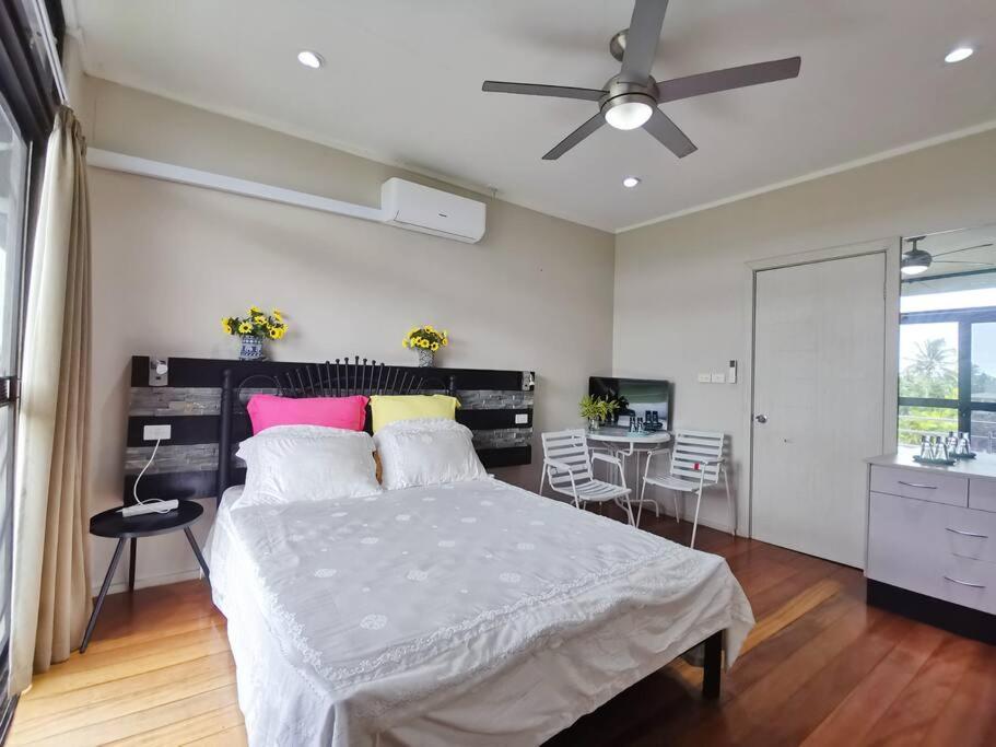 Master Bedroom in Shared Cozy River View Pool Apartment