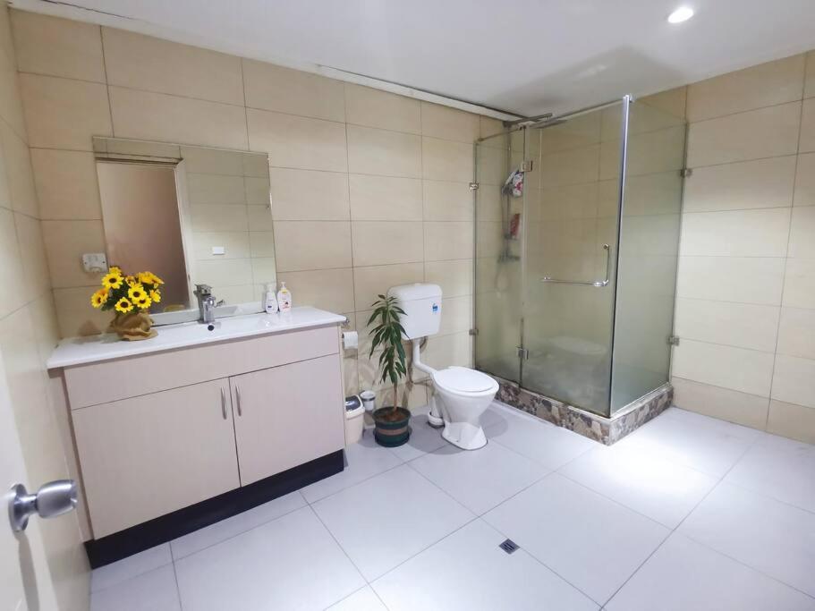 Master Bedroom in Shared Cozy River View Pool Apartment
