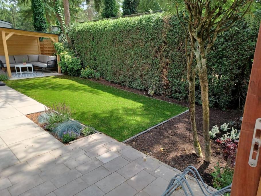 Boshuis met grote tuin I Vakantiepark met Zwembad view 2