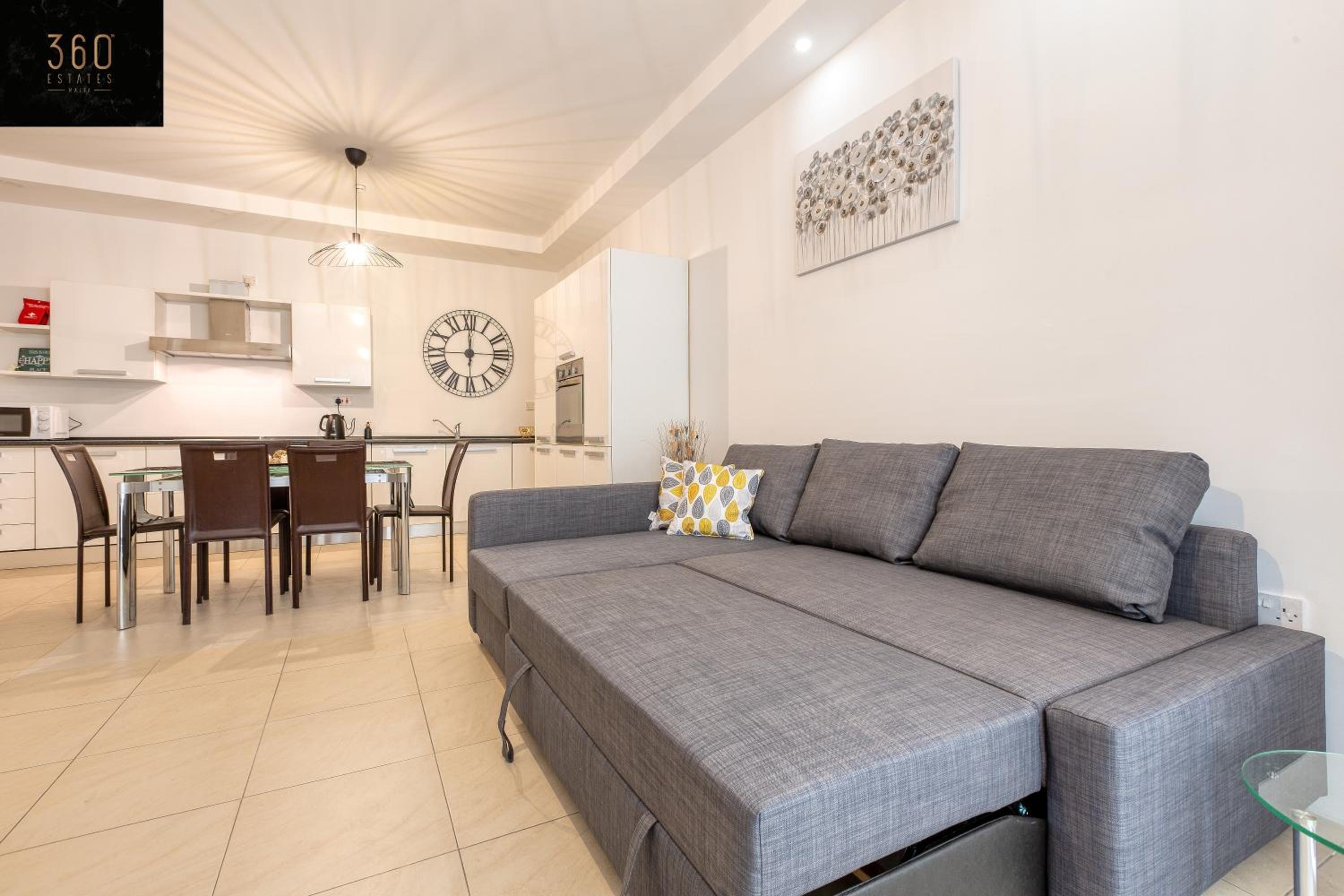 Wonderful, designer 2BR home with large Sofa & TV by 360 Estates photo 3